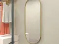 Дизайнерское овальное настенное зеркало Glass Memory Harmony в металлической раме золотого цвета